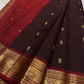 Midnight black Kanchipuram silk saree with traditional gold zari butta detail