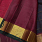 Closeup of the colour and border interplay on the Coffee Brown Handwoven Pure 2G Jari Kanjivaram Saree with Neli Veldhari Body and Maroonish Brown Borders.