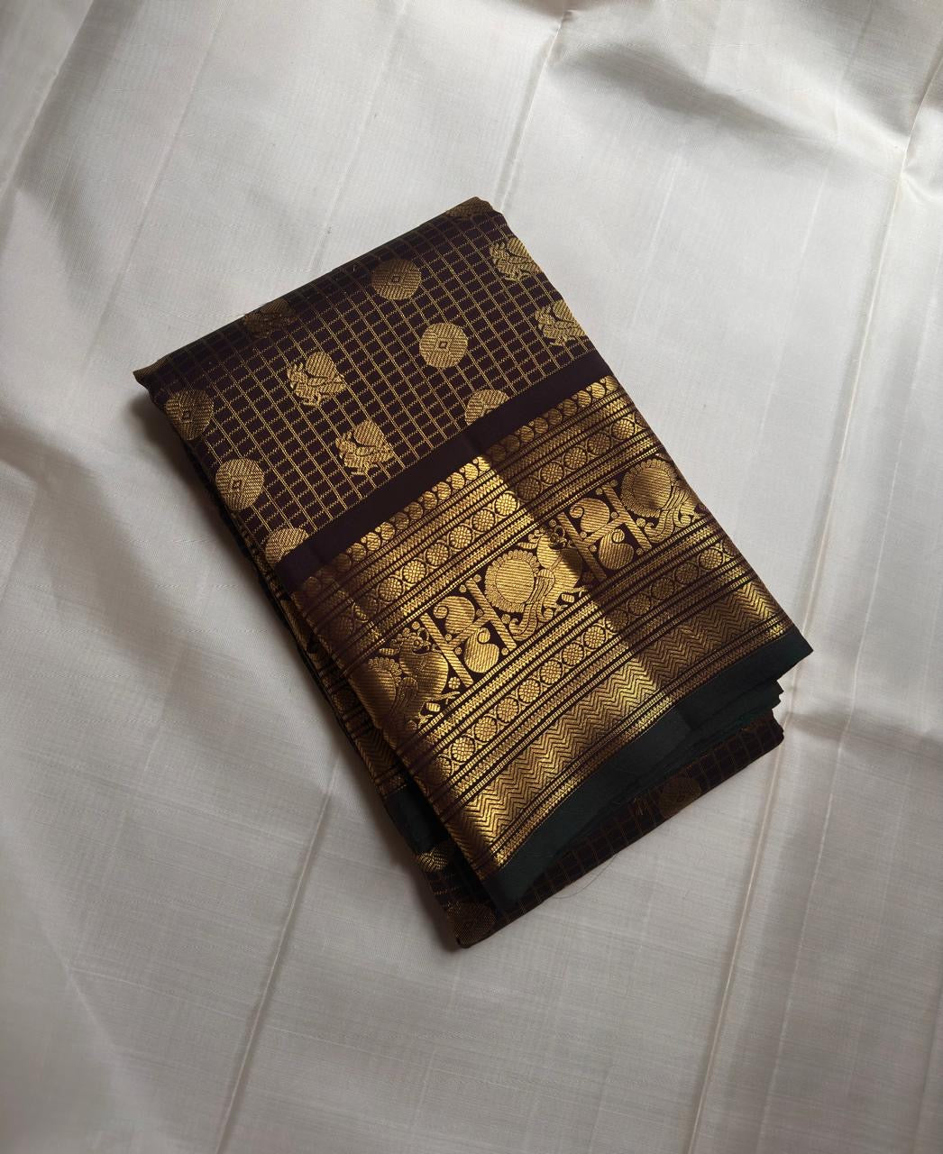 Cinnamon brown pure silk Kanjeevaram saree, close view of gold zari checks
