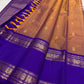 Sandalwood Copper and Royal Violet Kanchipuram saree with vertical zari lines and rich contrast border