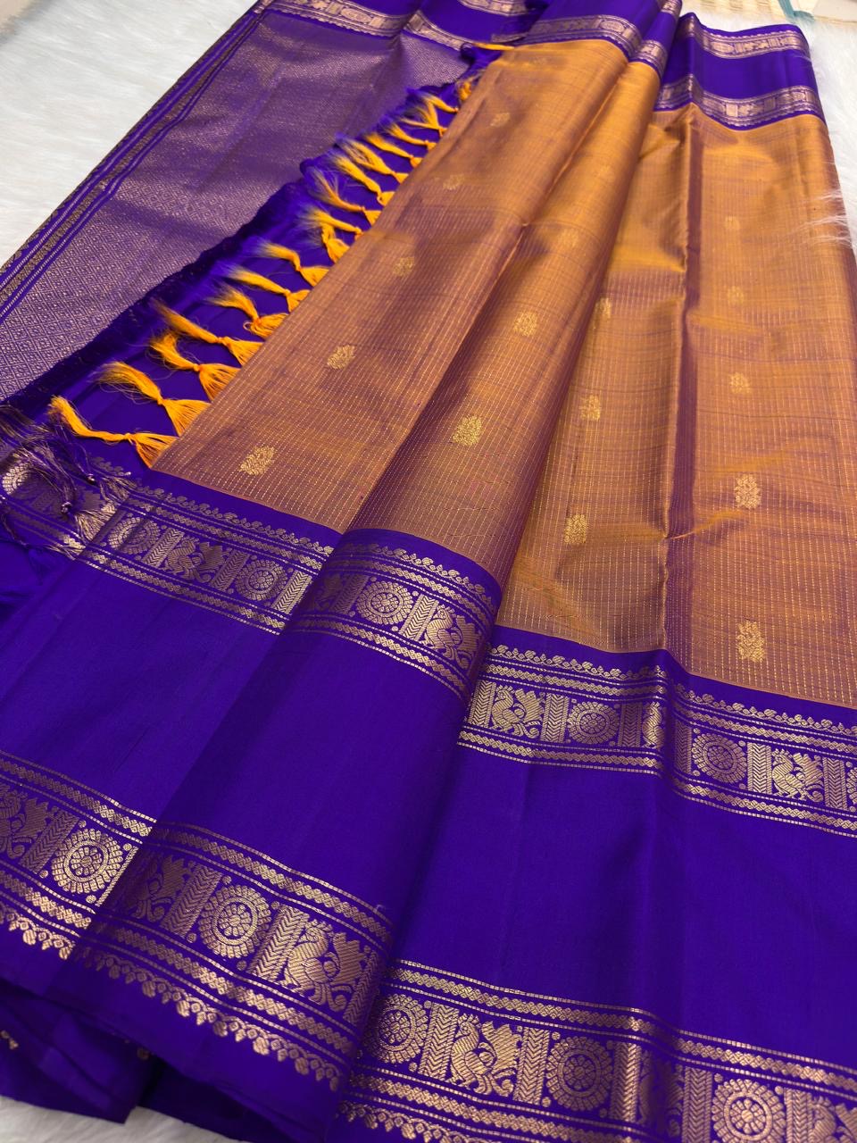 Sandalwood Copper and Royal Violet Kanchipuram saree with vertical zari lines and rich contrast border