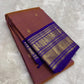 Rosewood copper Kanchipuram silk saree with royal violet border detail
