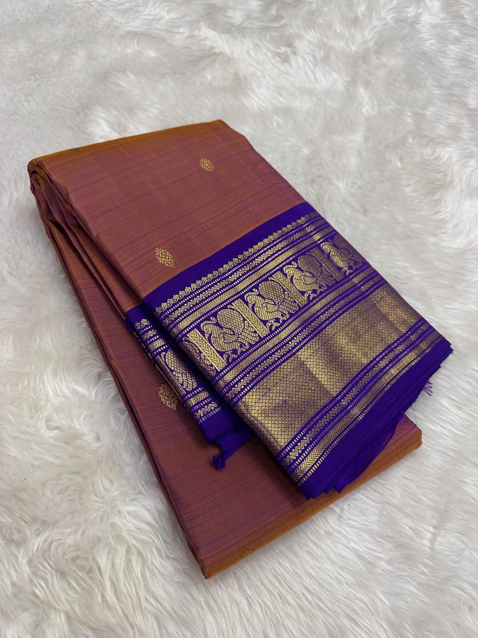 Rosewood copper Kanchipuram silk saree with royal violet border detail