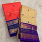 Coral orange pure silk Kanchipuram saree with royal violet korvai border – front drape view