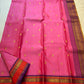 Detail of the coral-orange and purple border on the rose pink Kanchipuram saree