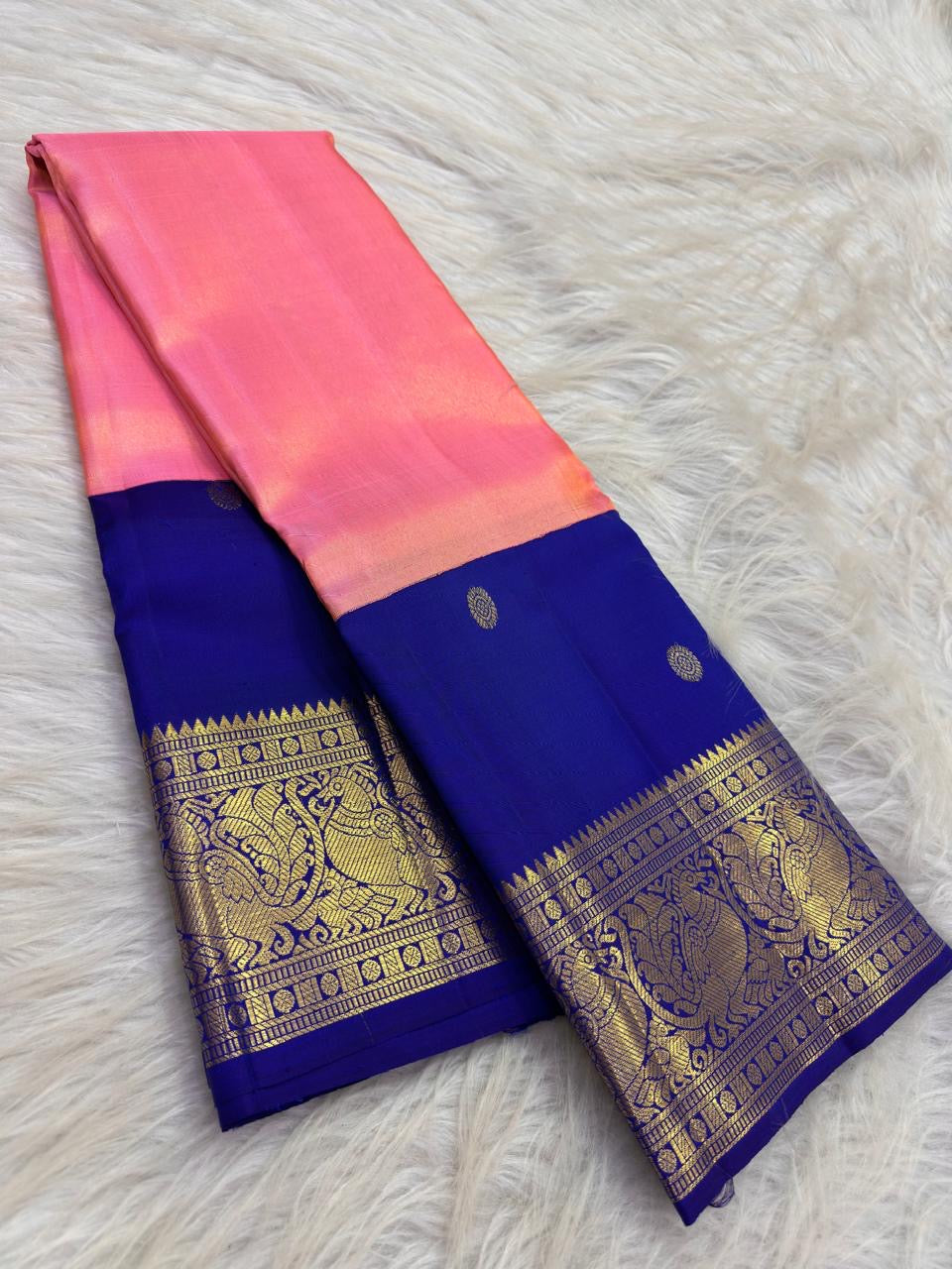 Coral Pink Pure Silk Kanchipuram Butta saree with grand Royal Blue Mayil zari border