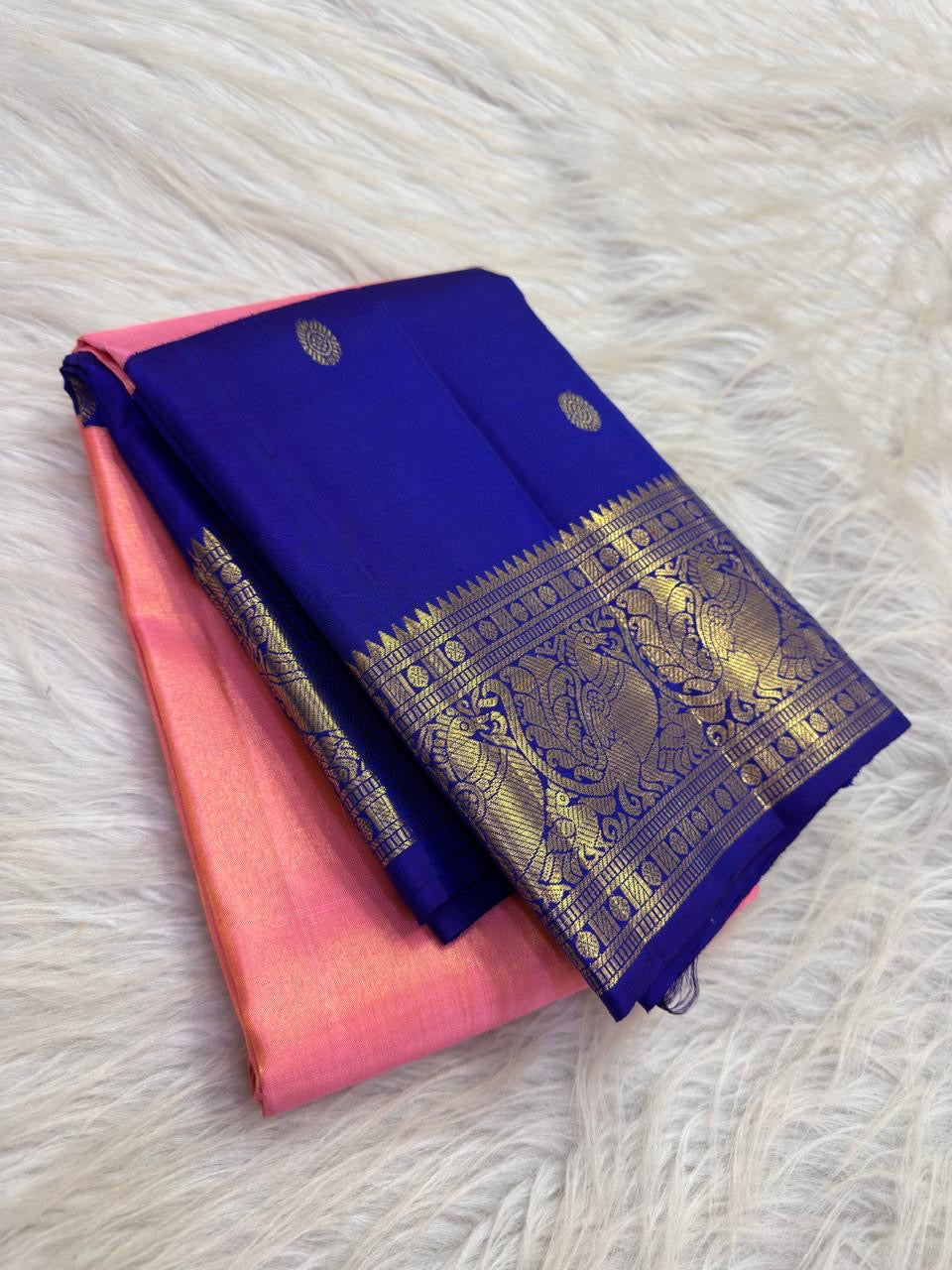 Coral Pink Kanjivaram silk saree with grand peacock gold zari border