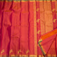 Coral Rose pure silk Vairaoosi saree with traditional gold zari border and contrasting green edge.