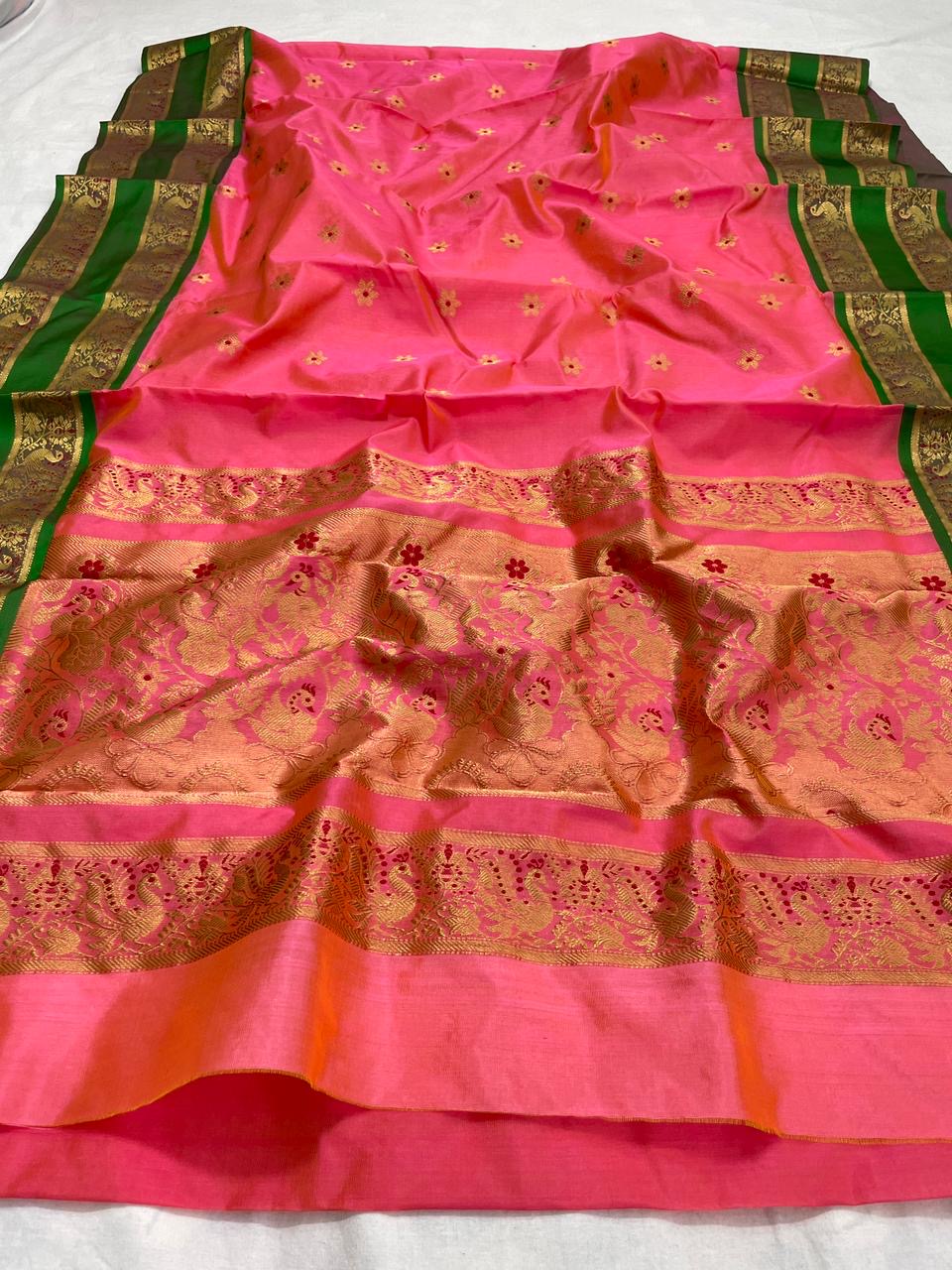 Coral pink handloom Pattu Silk Chanderi saree with emerald green woven border and gold-toned pallu