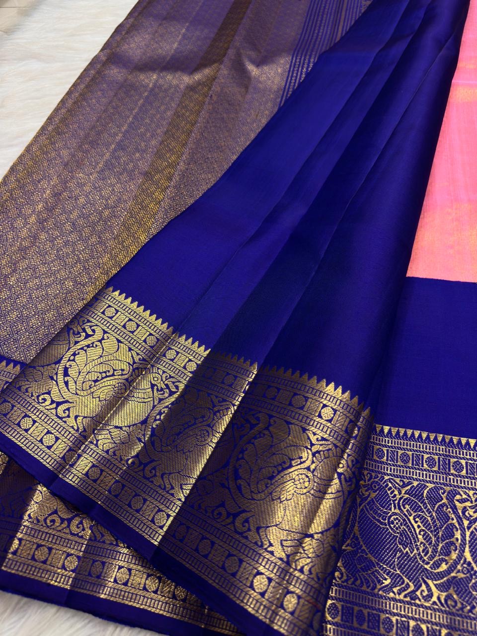 Coral Pink Pure Silk Kanchipuram saree with luminous gold zari detailing