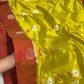 Coral red floral border with silver-gold blossoms on lime yellow Chanderi silk