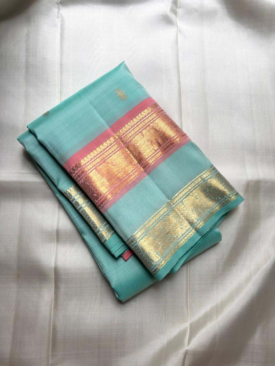Sea-Glass Aqua Handwoven Pure Silk Kanchipuram Saree with Coral-Rose Rettapet Border and Gold Zari Buttas