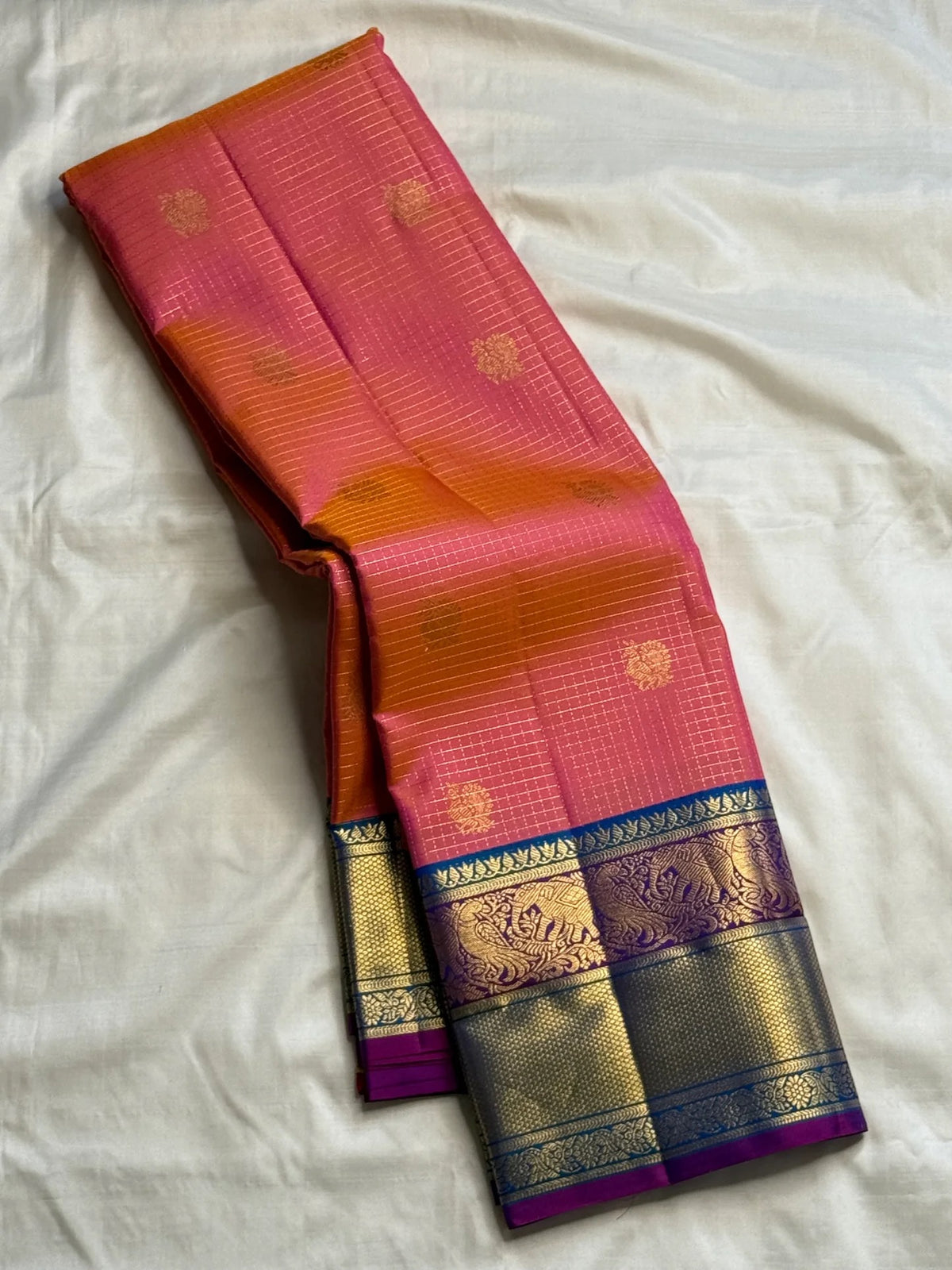 Coral sunset-orange handwoven Pure Silk Kanchipuram Zari Kattam saree with turquoise border