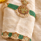 Cream silk velvet choker jeweled blouse on mannequin with green bead neckline and kundan pendant