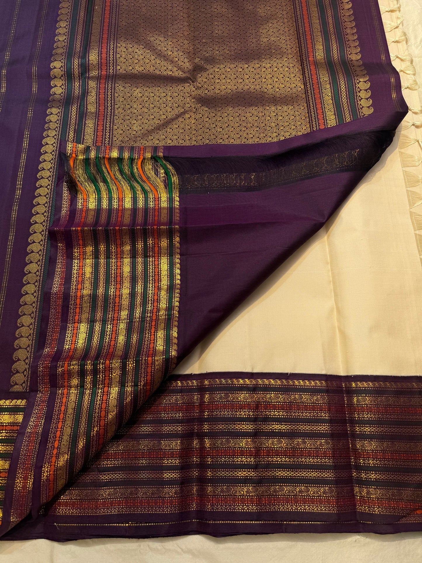 Royal purple and pink silk thread mayil chakram butta on cream ivory Kancheepuram saree — Idam Living