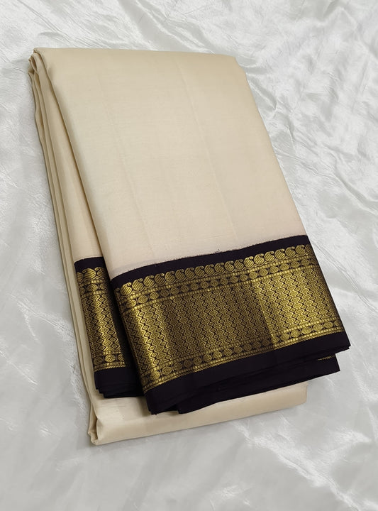 Kanchipattu silk saree in muted vanila white with intricate black gold border Korvai weave traditional zari detail