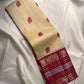 Cream Kanchipuram silk saree with Varisaipet elephant motif maroon border, front view