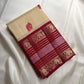 Cream Kanchipuram silk saree with maroon red Varisaipet elephant motif border, full view