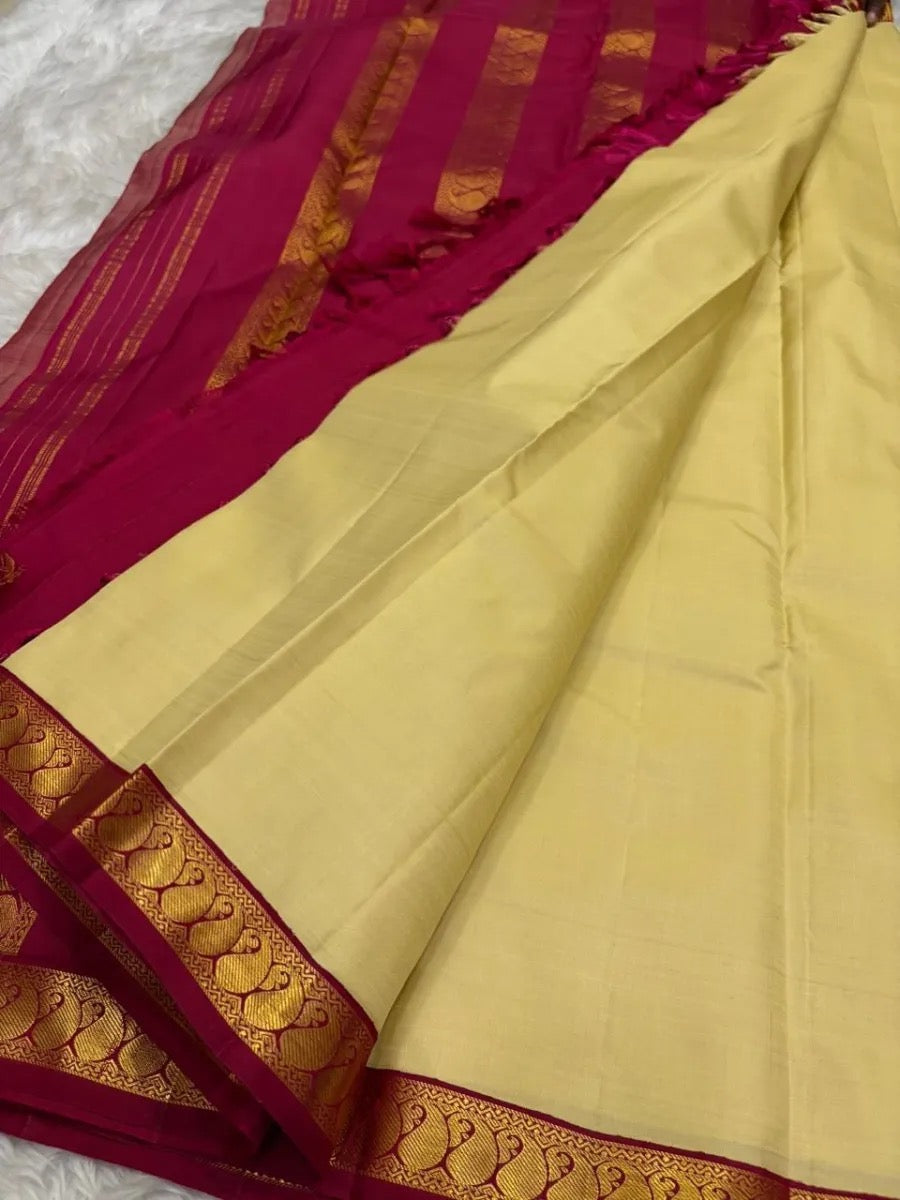 Cream Kanjeevaram saree with Paisley gold zari pallu