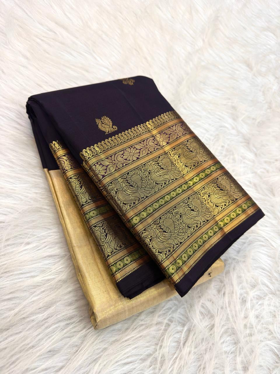 Cream tissue Kanjivaram saree with deep grape zari border