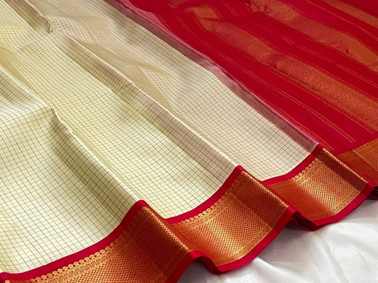 Red border with gold zari diamond lattice detail