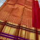 Close-up of the red pallu with dense gold zari motifs and the wide zari border with purple band, shipped from New Jersey USA.
