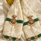 Cream silk velvet choker blouse flatlay with marigold garlands and kundan beadwork detailing