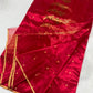 Close-up of gold floral buttas on the Crimson Red Jari Silk Chanderi saree