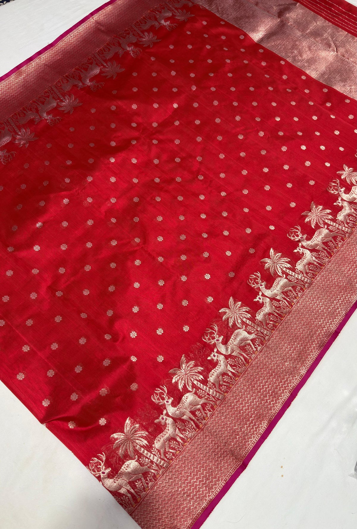 Small silver-toned floral dot motifs on crimson Chanderi silk