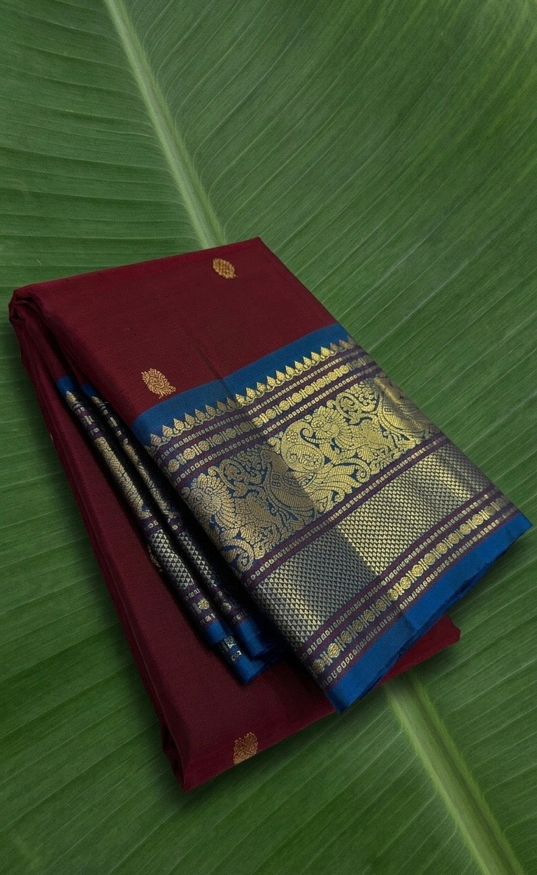 Crimson Maroon Kanchipuram Silk Saree with Peacock Blue Korvai Mayil Border