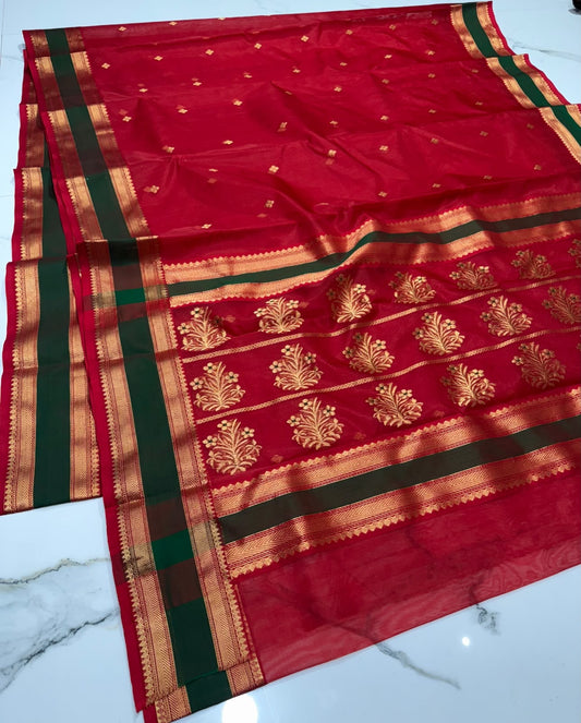 Crimson red Katan Silk Chanderi saree with forest green border framed by gold zari bands