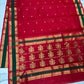 Close-up of the forest green and gold zari border on crimson red Chanderi silk