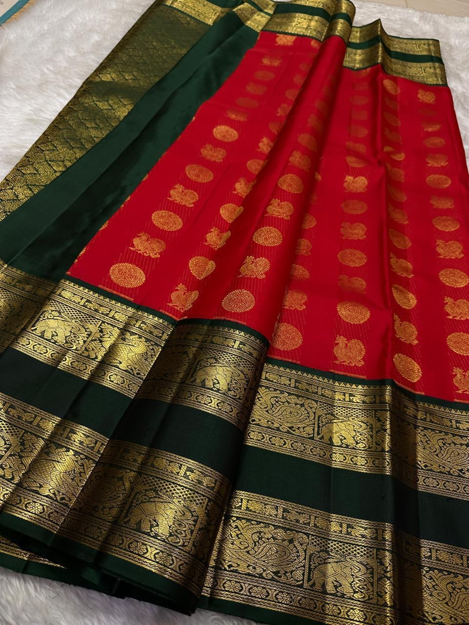 Kanchipattu silk saree in crimson red with deep emerald green border Rettapet Mayil Butta weave traditional zari detail