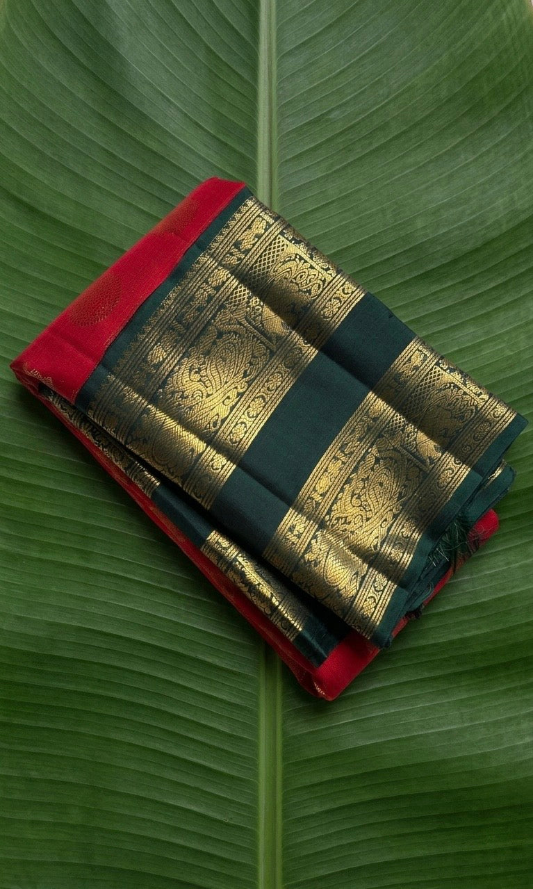 Kanchipuram silk saree in crimson red with deep emerald green border Rettapet Mayil Butta weave folded view