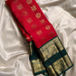 Kanchipattu silk saree in crimson red with deep emerald green border Rettapet Mayil Butta weave traditional zari detail