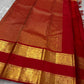 Crimson Red Kanchipuram Zari Kattam saree showing fine gold checked body and a broad traditional Sorgavasal Mayil and Manga border.