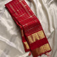 Crimson Red Kanchipuram Zari Kattam pallu with dense gold zari geometry and a large Sorgavasal Mayil and Manga border.