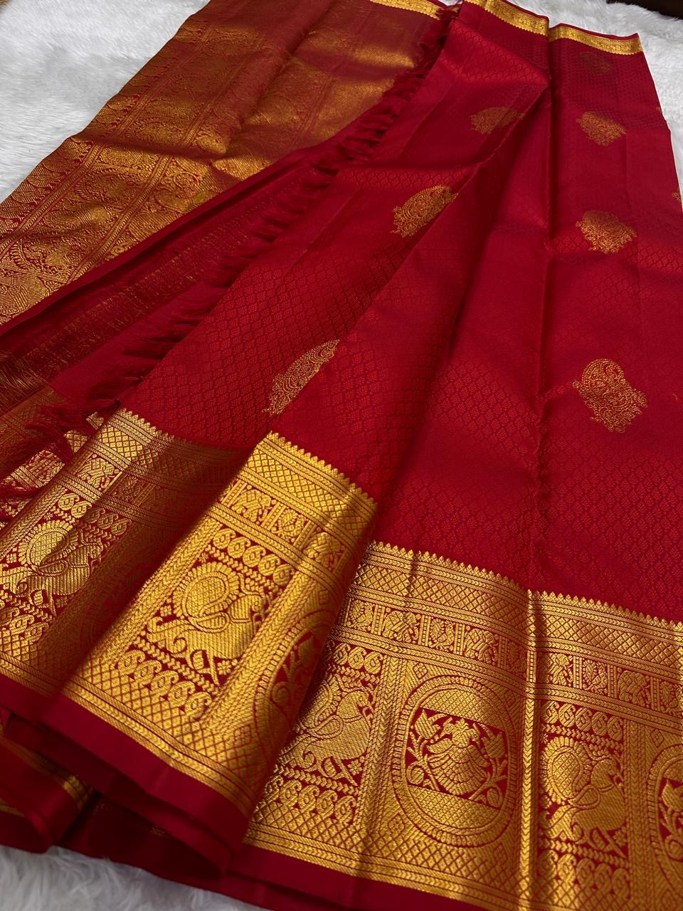 Crimson Red Handwoven Pure Silk Kanchipuram Saree with Ornate Zari Buttas and Gold Border – front full drape view