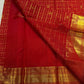 Close-up of maanga butta paisley in gold zari on crimson red Kanchipuram silk saree — Idam Living
