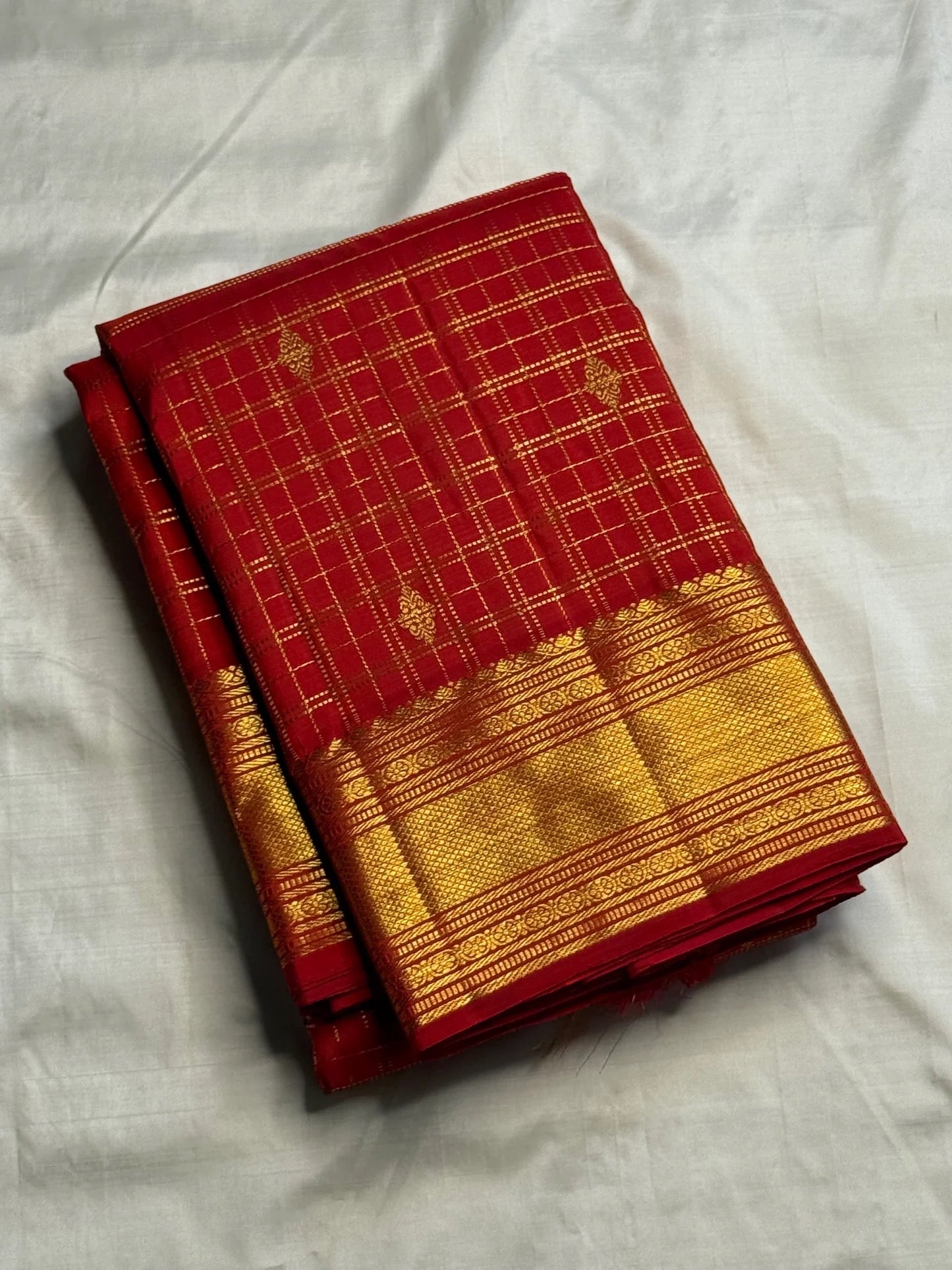 Zari kattam body close-up on crimson red handwoven Kanchipuram silk saree — Idam Living