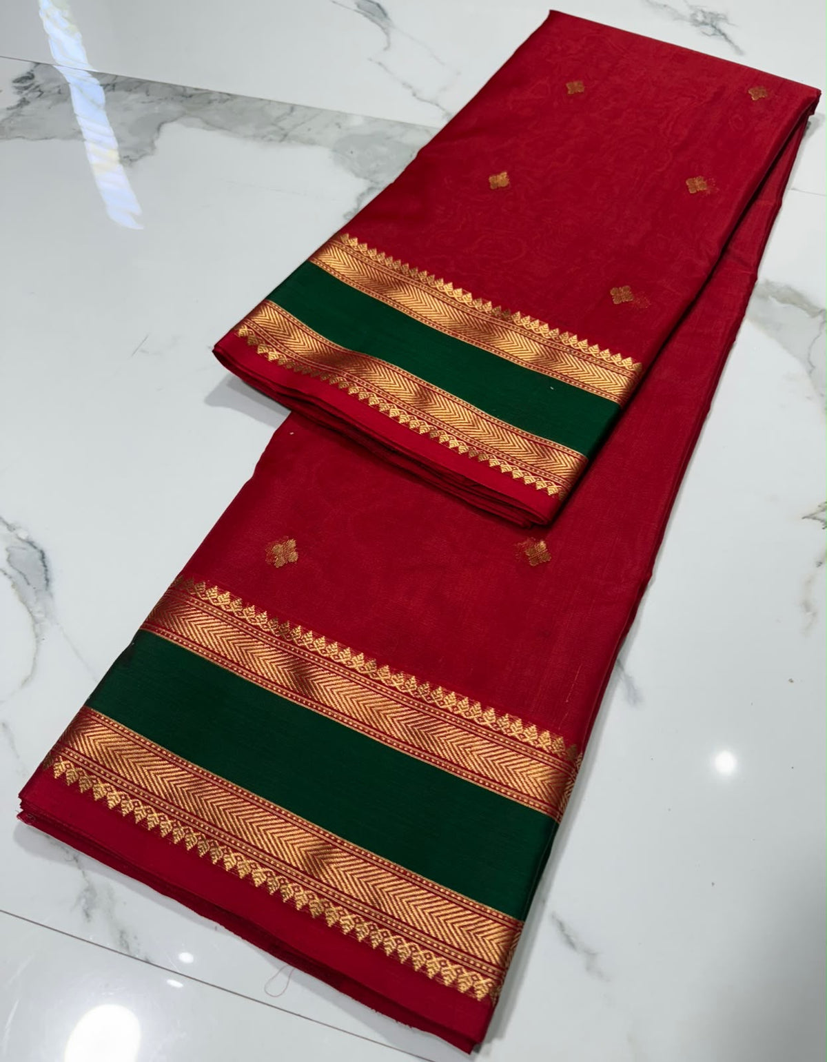 Crimson red Katan Silk Chanderi saree with gold buttas and a forest green gold zari border