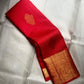 Crimson Red Handwoven Pure Silk Kanchipuram Saree with Ornate Zari Buttas and Gold Border – silk body weave close-up