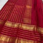 Dense gold zari pallu with repeating geometric field on saturated Vermilion Pinkish Red silk