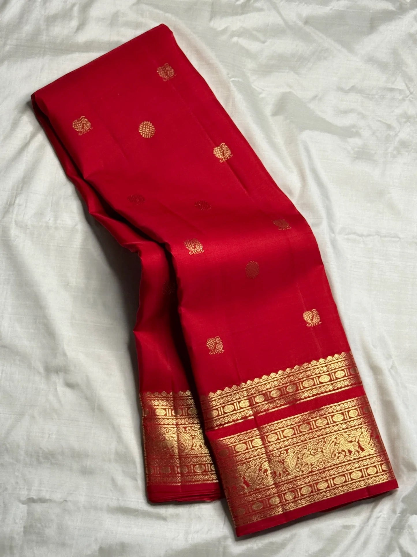 Crimson Varisaipet Kancheepuram silk saree folded, showing full drape and border