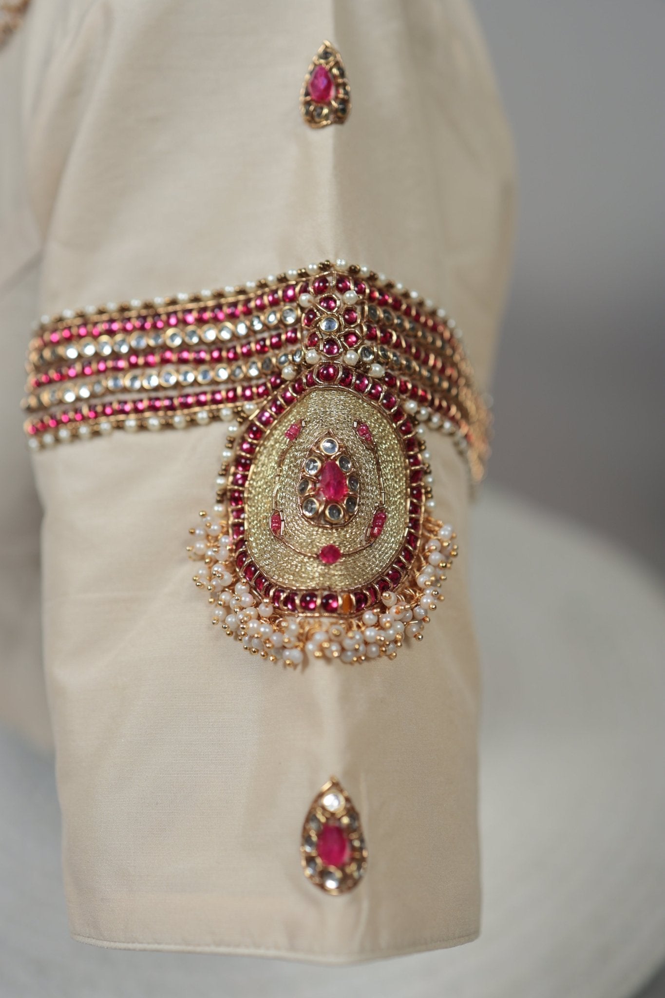 Cream silk Tanjore Treasure designer blouse with hand-set kemp stone embroidery