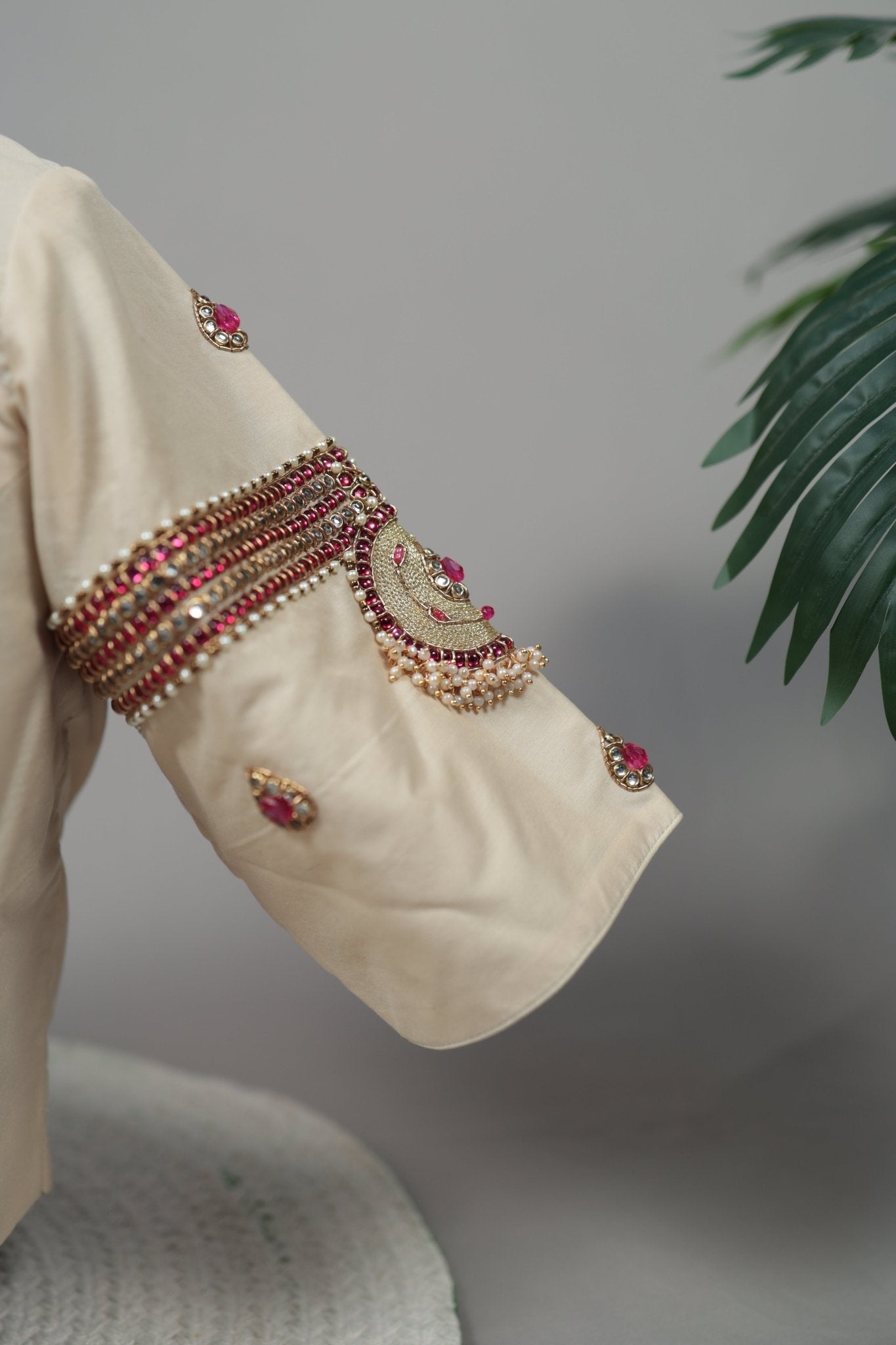 Side angle of cream silk Tanjore Treasure designer blouse with intricate embellishment