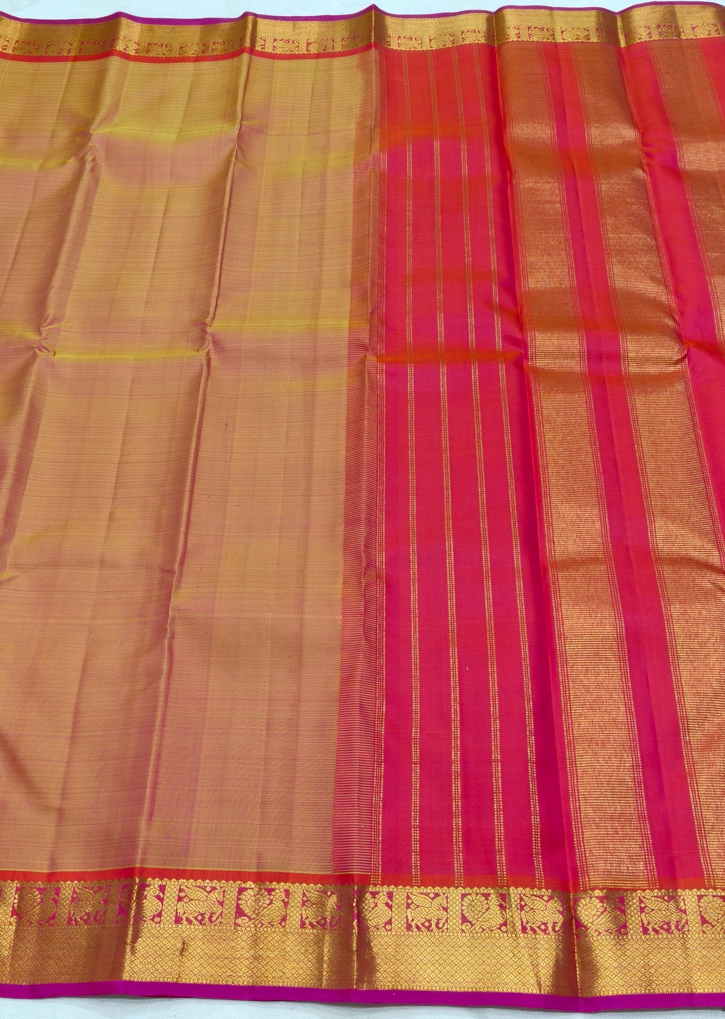 Warm sandal gold and fuchsia pink pure silk Kanjivaram saree with seer pallu – full drape view
