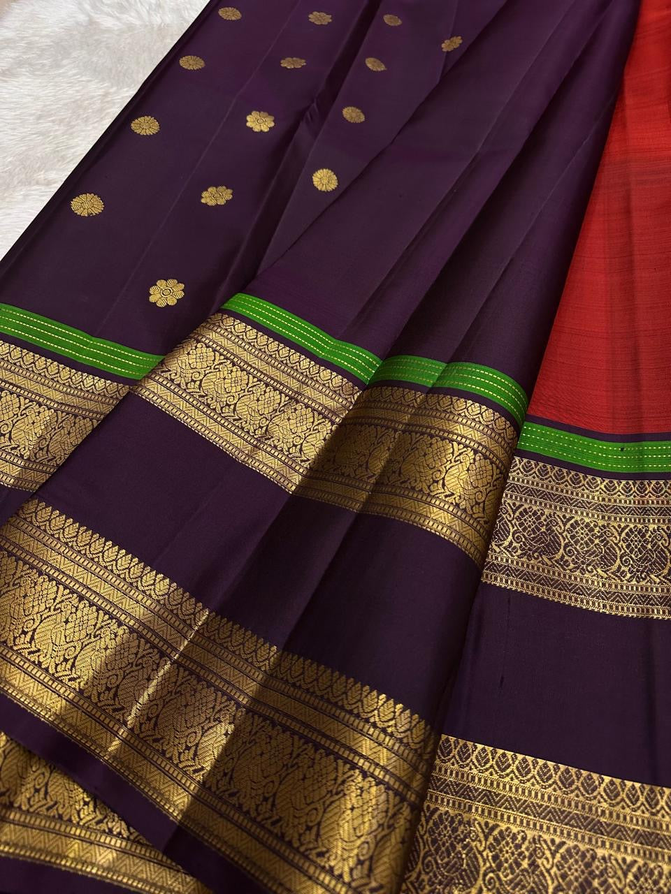 Traditional Kanchipuram Rettapet saree in jewel-toned purple with heritage ornamental zari detailing