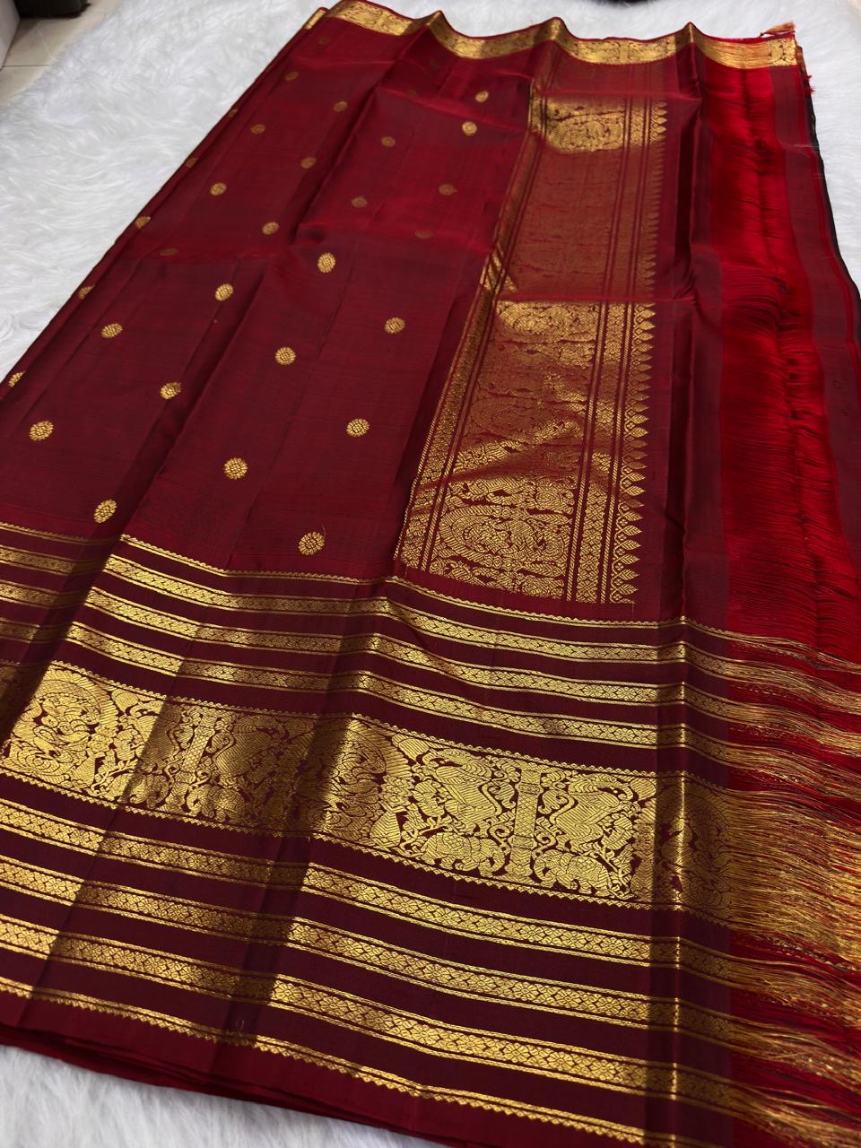 Arakku Red Varisaipet border with multiple warm gold zari ornamental registers on pure silk saree.