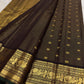 Close-up of the brown silk surface and woven zari work on this Kanchipuram saree.